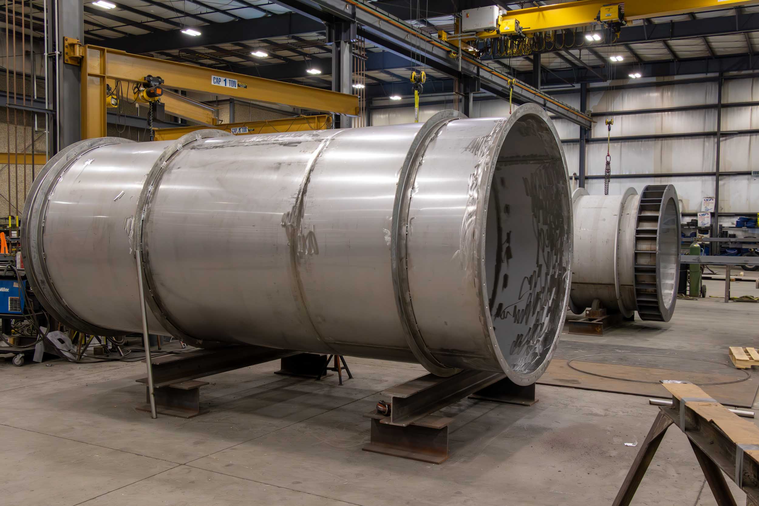 Large metal pipes inside industrial manufacturing facility